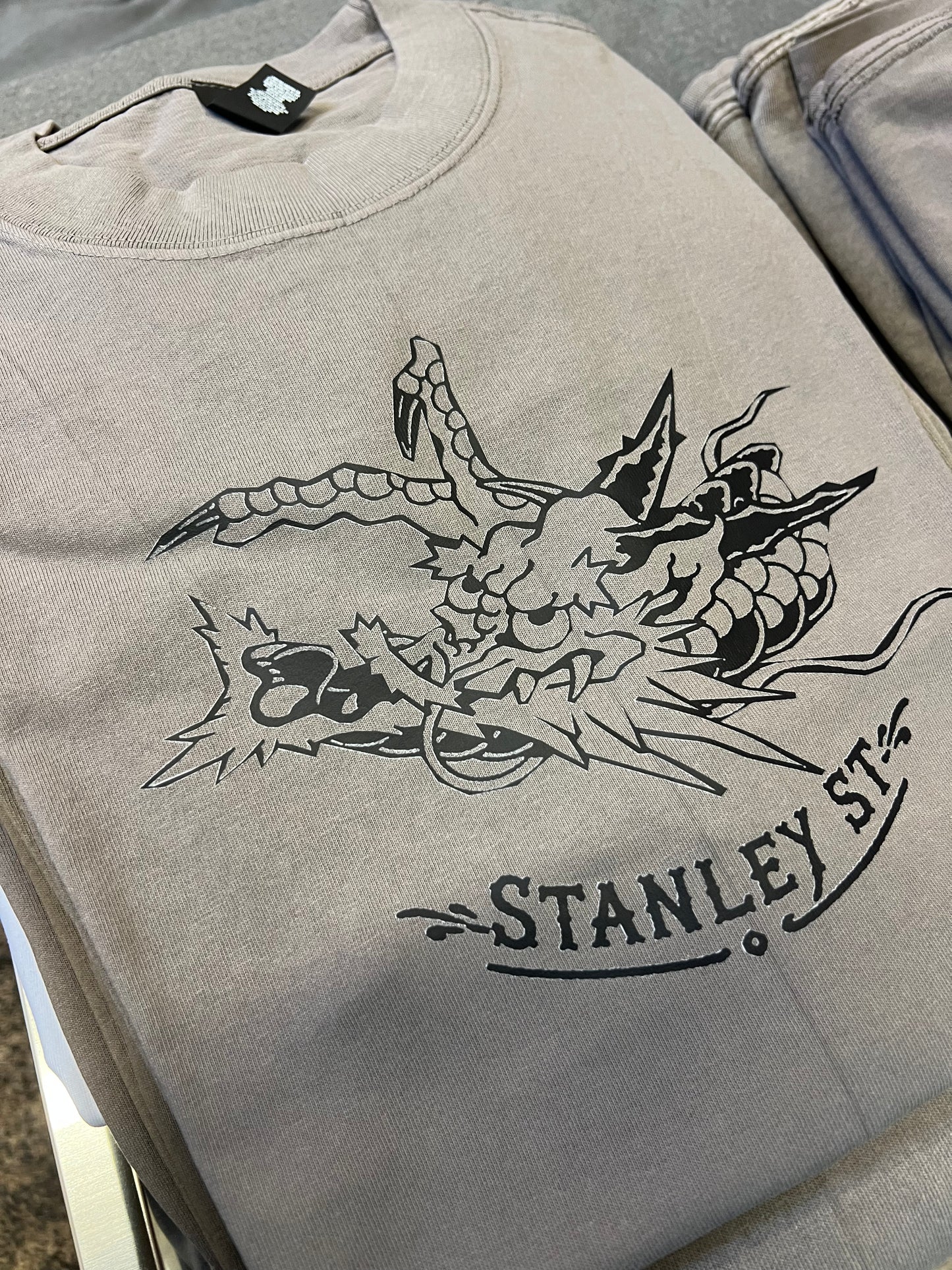 Black dragon on faded grey